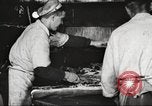 Image of workers in butchery United States USA, 1919, second 37 stock footage video 65675063928