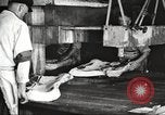 Image of workers in butchery United States USA, 1919, second 56 stock footage video 65675063928