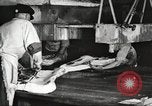 Image of workers in butchery United States USA, 1919, second 57 stock footage video 65675063928