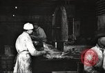Image of workers in butchery United States USA, 1919, second 29 stock footage video 65675063930