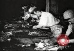 Image of workers in butchery United States USA, 1919, second 36 stock footage video 65675063930