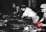 Image of workers in butchery United States USA, 1919, second 39 stock footage video 65675063930