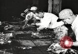 Image of workers in butchery United States USA, 1919, second 43 stock footage video 65675063930