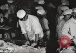 Image of workers in butchery United States USA, 1919, second 21 stock footage video 65675063931