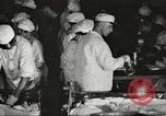 Image of workers in butchery United States USA, 1919, second 26 stock footage video 65675063931
