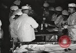 Image of workers in butchery United States USA, 1919, second 29 stock footage video 65675063931