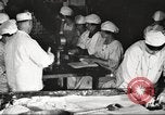 Image of workers in butchery United States USA, 1919, second 32 stock footage video 65675063931