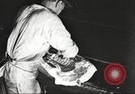 Image of workers in butchery United States USA, 1919, second 17 stock footage video 65675063932