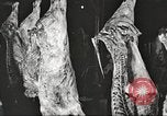 Image of workers in butchery United States USA, 1919, second 23 stock footage video 65675063932