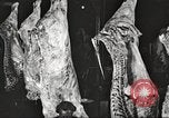Image of workers in butchery United States USA, 1919, second 26 stock footage video 65675063932