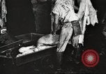 Image of workers in butchery United States USA, 1919, second 10 stock footage video 65675063935