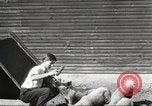 Image of workers in barn United States USA, 1920, second 4 stock footage video 65675063942