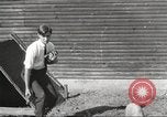 Image of workers in barn United States USA, 1920, second 12 stock footage video 65675063942