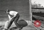 Image of workers in barn United States USA, 1920, second 35 stock footage video 65675063942
