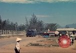 Image of traffic on road Vietnam, 1965, second 33 stock footage video 65675064025