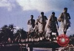 Image of Pacific islanders climb trees and repair nets Pacific Theater, 1944, second 17 stock footage video 65675064073