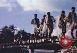 Image of Pacific islanders climb trees and repair nets Pacific Theater, 1944, second 18 stock footage video 65675064073