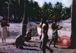 Image of Pacific islanders climb trees and repair nets Pacific Theater, 1944, second 21 stock footage video 65675064073