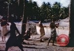 Image of Pacific islanders climb trees and repair nets Pacific Theater, 1944, second 22 stock footage video 65675064073