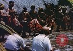 Image of Pacific islanders climb trees and repair nets Pacific Theater, 1944, second 28 stock footage video 65675064073