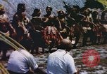 Image of Pacific islanders climb trees and repair nets Pacific Theater, 1944, second 29 stock footage video 65675064073
