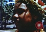 Image of Pacific islanders climb trees and repair nets Pacific Theater, 1944, second 35 stock footage video 65675064073
