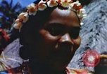 Image of Pacific islanders climb trees and repair nets Pacific Theater, 1944, second 36 stock footage video 65675064073