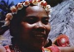 Image of Pacific islanders climb trees and repair nets Pacific Theater, 1944, second 38 stock footage video 65675064073
