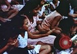 Image of Pacific islanders climb trees and repair nets Pacific Theater, 1944, second 40 stock footage video 65675064073