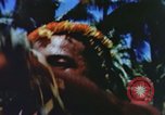 Image of Pacific islanders climb trees and repair nets Pacific Theater, 1944, second 41 stock footage video 65675064073