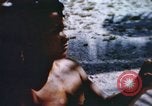 Image of Pacific islanders climb trees and repair nets Pacific Theater, 1944, second 55 stock footage video 65675064073