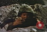 Image of US Marines in combat on Pacific island Pacific Theater, 1944, second 26 stock footage video 65675064074