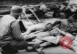 Image of dead bodies Germany, 1945, second 11 stock footage video 65675064121
