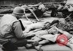 Image of dead bodies Germany, 1945, second 12 stock footage video 65675064121