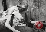 Image of dead bodies Germany, 1945, second 58 stock footage video 65675064121