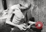 Image of dead bodies Germany, 1945, second 62 stock footage video 65675064121