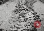 Image of dead bodies Germany, 1945, second 18 stock footage video 65675064123