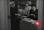 Image of man and woman work in office Washington DC USA, 1940, second 42 stock footage video 65675064156