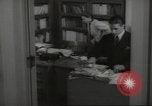 Image of man and woman work in office Washington DC USA, 1940, second 45 stock footage video 65675064156