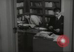 Image of man and woman work in office Washington DC USA, 1940, second 46 stock footage video 65675064156
