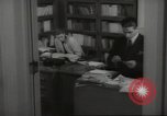 Image of man and woman work in office Washington DC USA, 1940, second 47 stock footage video 65675064156