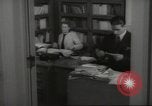 Image of man and woman work in office Washington DC USA, 1940, second 48 stock footage video 65675064156
