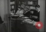 Image of man and woman work in office Washington DC USA, 1940, second 52 stock footage video 65675064156