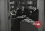 Image of man and woman work in office Washington DC USA, 1940, second 58 stock footage video 65675064156