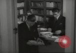 Image of man and woman work in office Washington DC USA, 1940, second 59 stock footage video 65675064156