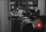 Image of man and woman work in office Washington DC USA, 1940, second 60 stock footage video 65675064156