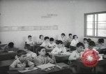 Image of Jewish children receiving instruction at Bialik Hebrew Day School Palestine, 1945, second 33 stock footage video 65675064275
