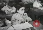 Image of Jewish children receiving instruction at Bialik Hebrew Day School Palestine, 1945, second 51 stock footage video 65675064275