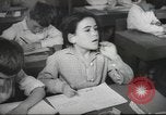 Image of Jewish children receiving instruction at Bialik Hebrew Day School Palestine, 1945, second 52 stock footage video 65675064275
