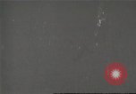 Image of An automobile almost hits pedestrians in center of a road Michigan United States USA, 1916, second 1 stock footage video 65675064462